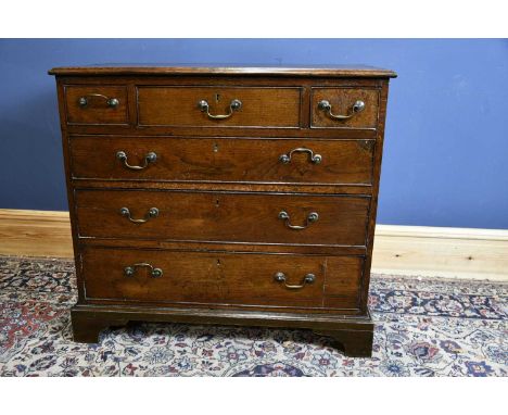 A late George III oak chest with three short above three long drawers, on bracket feet, width 94cm.