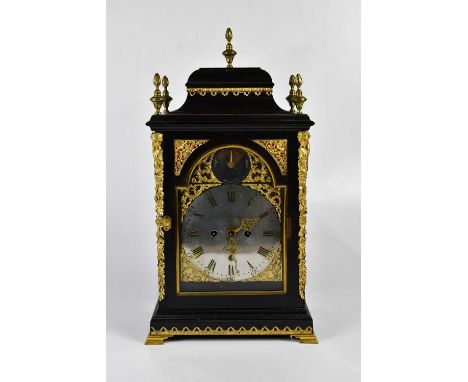 THOMAS WAGSTAFF, LONDON; an 18th century ebonised bracket clock with five applied brass finials above applied brass decoratio