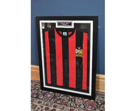 MANCHESTER CITY; a retro-style football shirt, signed by Summerbee, Lee and Bell, 67 x 87cm, framed and glazed.Condition Repo