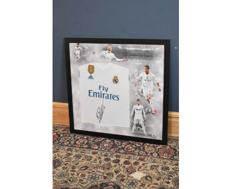 CRISTIANO RONALDO; a signed Real Madrid football shirt, 85 x 83cm, framed and glazed.Condition Report: Creasing and light gen