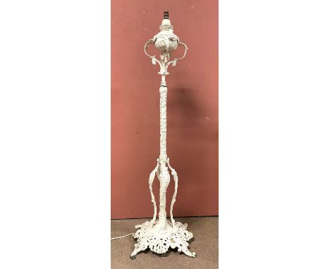 A Victorian Coalbrookdale style white painted cast iron oil lamp (converted to electricity) on pierced and cast scrolling bas