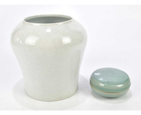 A Korean celadon glazed trinket box and cover, the cover relief decorated with floral sprays, diameter 10cm, together with an