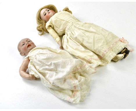 KAMMER &amp; REINHARDT; an early 20th century bisque headed model of a baby, with celluloid articulated limbs, length 27cm, a