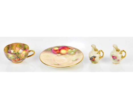 JOHN FREEMAN FOR ROYAL WORCESTER; a miniature hand painted tea cup together with further miniature hand painted saucer and tw