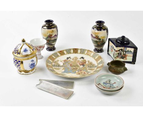 A mixed collection of oriental ceramics to include a pair of blue ground satsuma vases, a bronze incense, tea cup, two white 