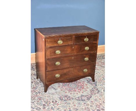 A Georgian mahogany chest of two short over three long drawers, on bracket feet, height 91cm, width 92cm, depth 46cm.