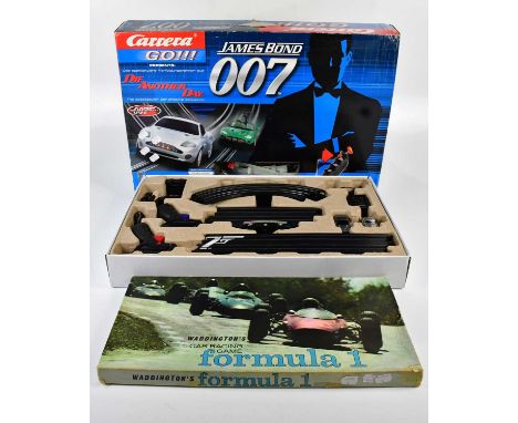 SCALEXTRIC; a Microscalextric James Bond Aston Martin DB5 and Aston Martin DBS action set, together with a Carrera GO!!! 'Die