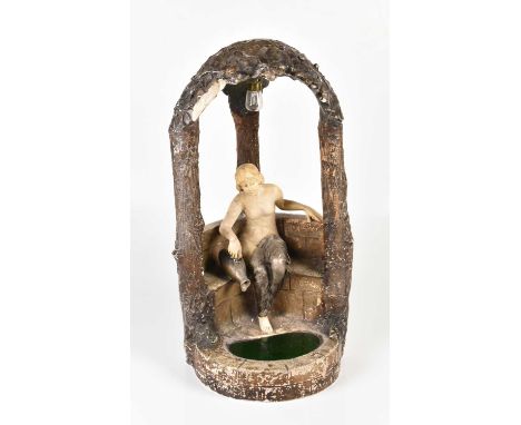 An Art Nouveau figurative plaster lamp, modelled as a maiden within a grotto, height 53cm.