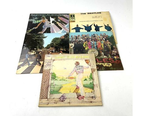 A small collection of records to include Goodbye Yellow Brick Road, Elton John, Sgt Pepper's Lonely Hearts Club Band, The Bea