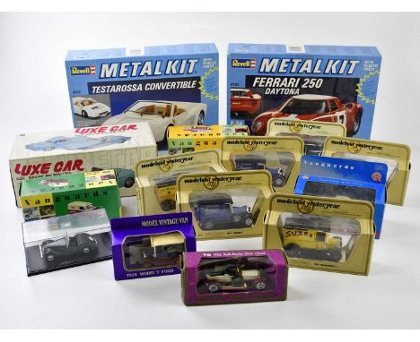 A collection of model vehicles, including Vanguard, Luxe Model Vehicle, Revell model kits, etc.