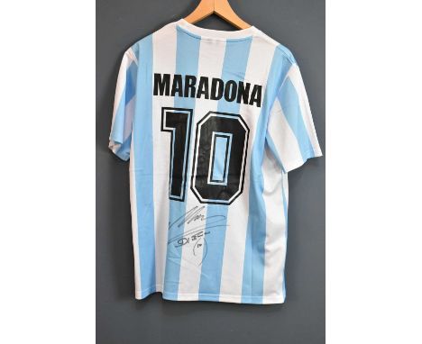 DIEGO MARADONA; a signed 1986 retro-style Argentina football shirt, signed to the reverse, size L.  Condition Report: Creasin