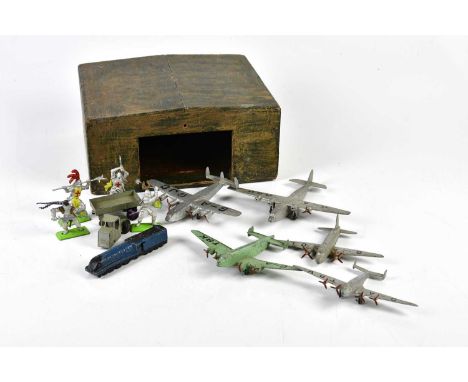 A scratch built aircraft hanger, with model aeroplanes, together with some detailed figures of knights.