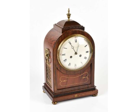 An Edwardian Regency style brass inlaid mahogany eight day mantle clock, the Roman numeral dial signed Ollivant &amp; Botsfor