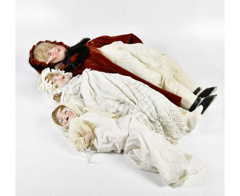 ARTHUR SCHOENAU &amp; HOFFMEISTER, PORZELLANFABRIK &amp; BURGGRUB; a German bisque headed doll, in red cloak, 77cm, together 
