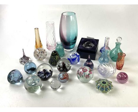 A collection of sixteen paperweights to include eleven Caithness, one Langham Glass House, a Mdina example, a Strathearn and 