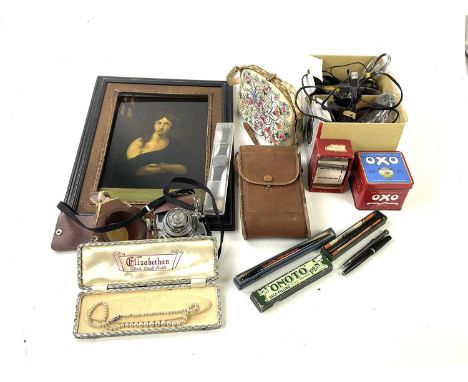 An assortment of collectors' items to include a Victorian style print on glass portrait, Canon EOS accessories, a Koroll 24 c