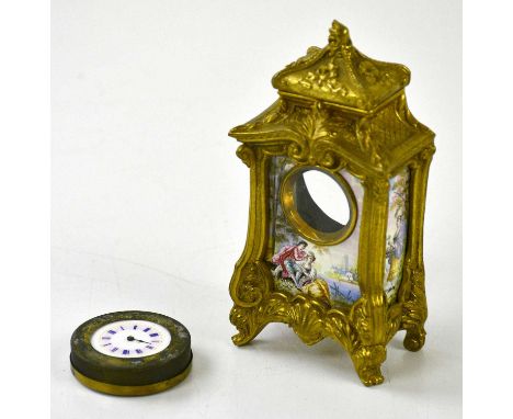An early 20th century gilt metal timepiece with enamel panels decorated with classical figures in landscapes, the enamel dial