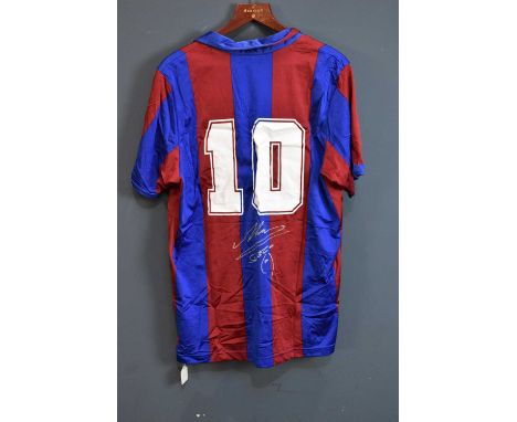 DIEGO MARADONA; a signed Barcelona retro-style shirt, signed to the reverse.Condition Report: Creasing and light general wear