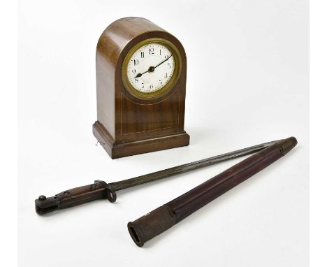 A WWI Lee Enfield bayonet with scabbard and an Edwardian mantel clock, the enamel dial set with Arabic and Roman numerals, he