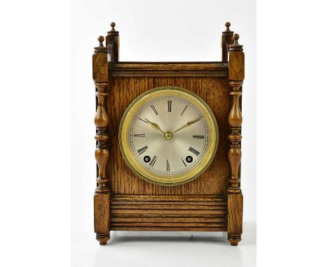 WINTERHALDER &amp; HOFMEIER; a late 19th century German oak and pine mantel clock, the silvered dial set with Roman numerals,