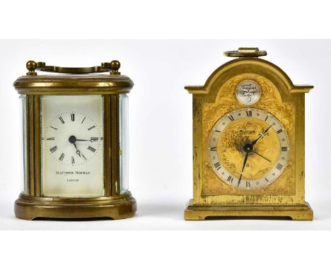 MATTHEW NORMAN, LONDON; a brass cased carriage clock of oval form with swing handle, the enamel dial set with Roman numerals,
