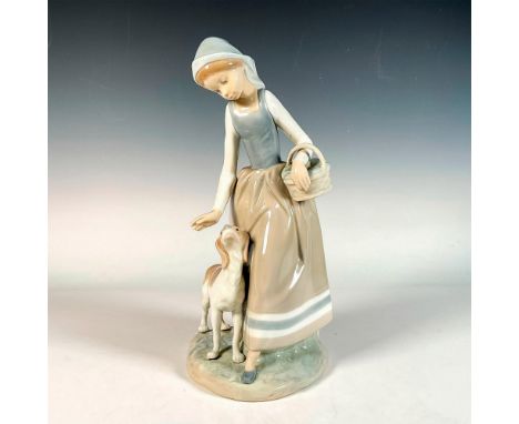 Glossy finish; depicting a young woman carrying a basket and walking with a puppy. Nao by Lladro backstamp. Issued: 20th c.Di