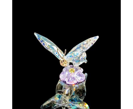 This piece offers a true-to-nature interpretation of an Asian Swallow-tail butterfly landing on a single blossom. It sparkles