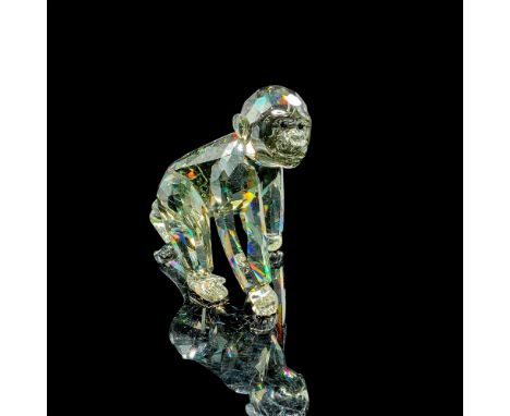 Swarovski Crystal Society small baby gorilla in gray crystal with black eyes. Swarovski backstamp to underside of left back f