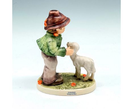Matte finished figural with lamb, colored in brown, green and orange. Goebel backstamp. M.I. Hummel impressed mark. 395. This