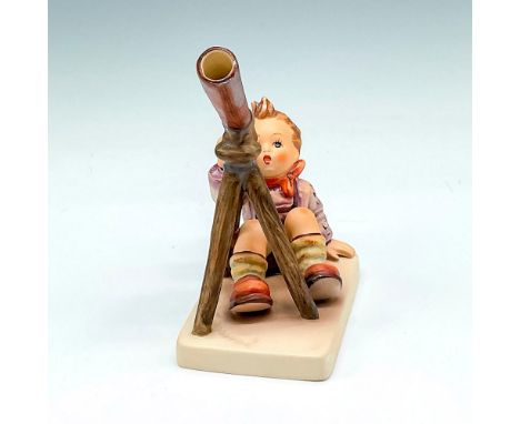 Hand painted, matte finished figural looking through telescope. Goebel backstamp. M.I. Hummel impressed mark. 132. This item 