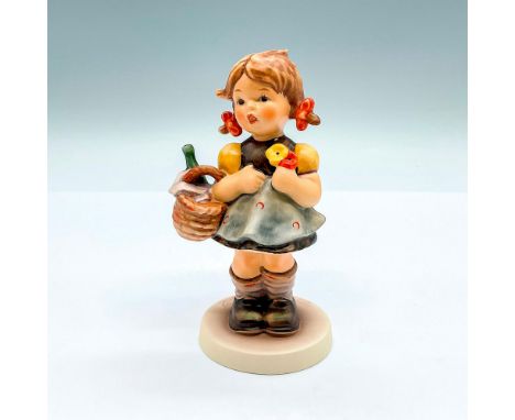 Hand painted exclusive edition figure of a young girl with a basket of wine. Goebel backstamp. This item has its original box