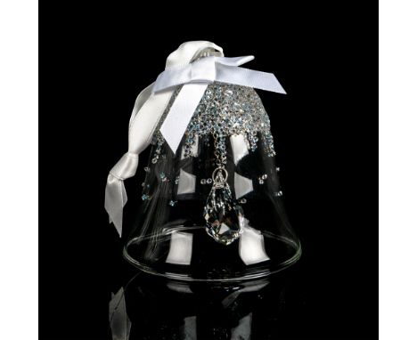 First edition ornament decorated with hundreds of crystal stones and a white satin ribbon. Swarovski backstamp. This item has