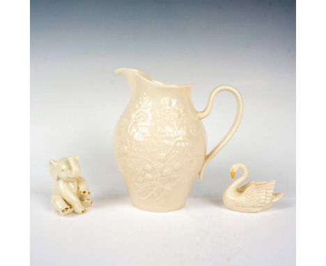 Beautiful set including a handled pitcher embossed with a nice floral pattern, an elephant figurine, and a swan figurine. Del