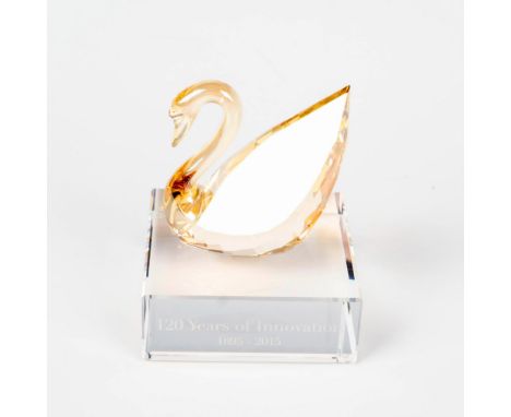Limited edition, commemorating the 120th anniversary of Swarovski. Made from golden shadow crystal and stands on a clear crys