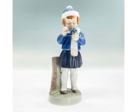 Glazed figure of a girl in a blue blouse, skirt and hat holding flowers. Bing &amp; Grondahl backstamp. Dimensions: 2.5"L x 2