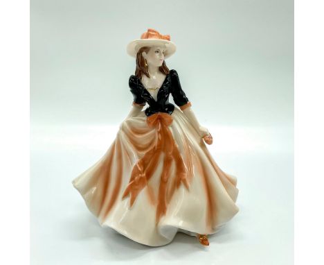 Fine bone china figure that is part of the Les Petites Collection. Depicts lady in a sandstone orange and white gown with mat