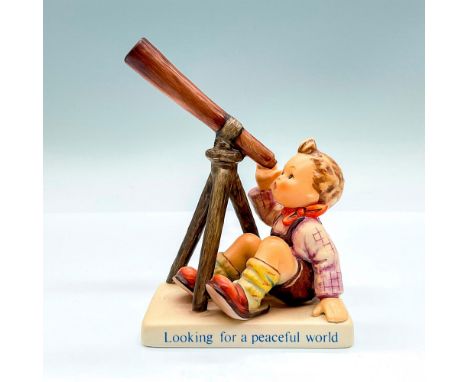 Hand painted figure of a young boy with a telescope. Captions on the base: Looking For A Peaceful World. Goebel backstamp. Th