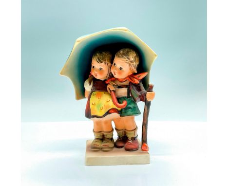 An adorable hand painted figure of a young boy and girl under a large umbrella. Goebel backstamp. Artist: M.I. HummelIssued: 