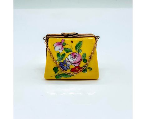 A hand painted yellow purse-shaped box decorated with colorful flowers. The brass chain represents as the handle of the purse