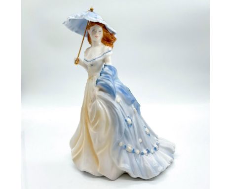 Fine bone china that is part of the Summer Romance Collection. Depicts lady in a soft yellow - orange and blue dress with mat