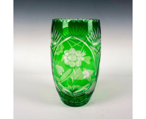A green cut to clear vessel embellished with flower and crisscross patterns. Thumbprint patterns surround the borders. Dimens