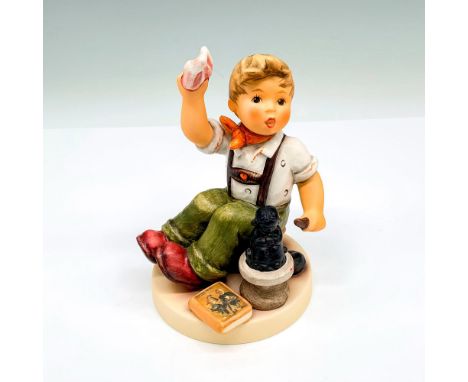 This porcelain figurine depicts a boy crafting a sculpture. Includes medallion stating it was made exclusively for Skrobek's 