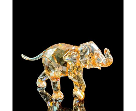 Lead crystal figural excellently crafted in a light sand color. Swarovski acid mark on bottom of foot. Item includes original