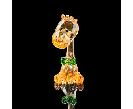 2018 Swarovski Crystal Society Loyalty Gift. Adorable faceted topaz-colored crystal giraffe wearing a green crystal bow tie. 