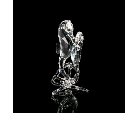 Lead crystal piece modeled as a couple of seahorses swimming in the calm ocean waters. Swarovski etched backstamp. This item 