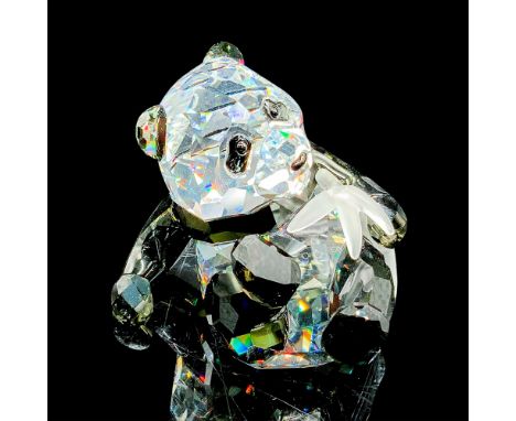 Features an adorable seated panda cub made of clear and black colored lead crystal, holding a frosted crystal bamboo stick. I