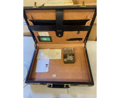 A black leather Briefcase containing mixture of old coins included