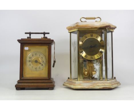 Two Mantle Clocks, including a Kundo Anniversary type clock in hexagonal glass and onyx casing together with a Victorian Wood