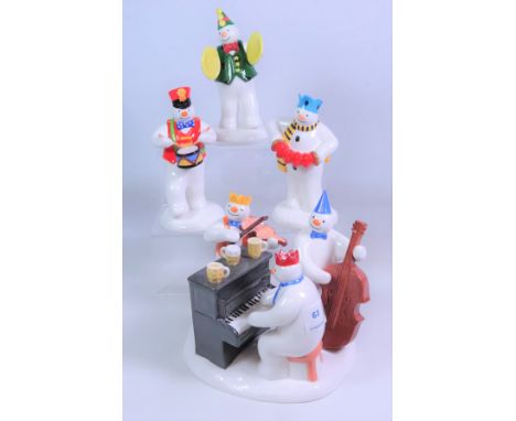 Four Coalport The Snowman musical figurines; 'The Band Plays on', 'Crash went the Cymbals', 'The Drummer' & 'Play it Again', 