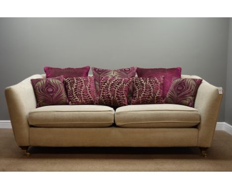 'Alston' two seat sofa upholstered in neural fabric, turned feet with brass cups and castors, W225cm - 1 year old   Condition